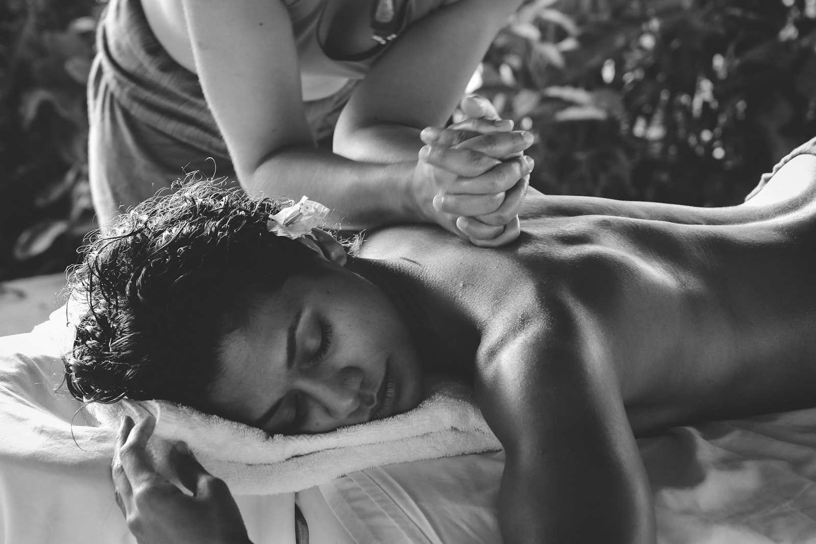 Hands working into the fascia of the back
